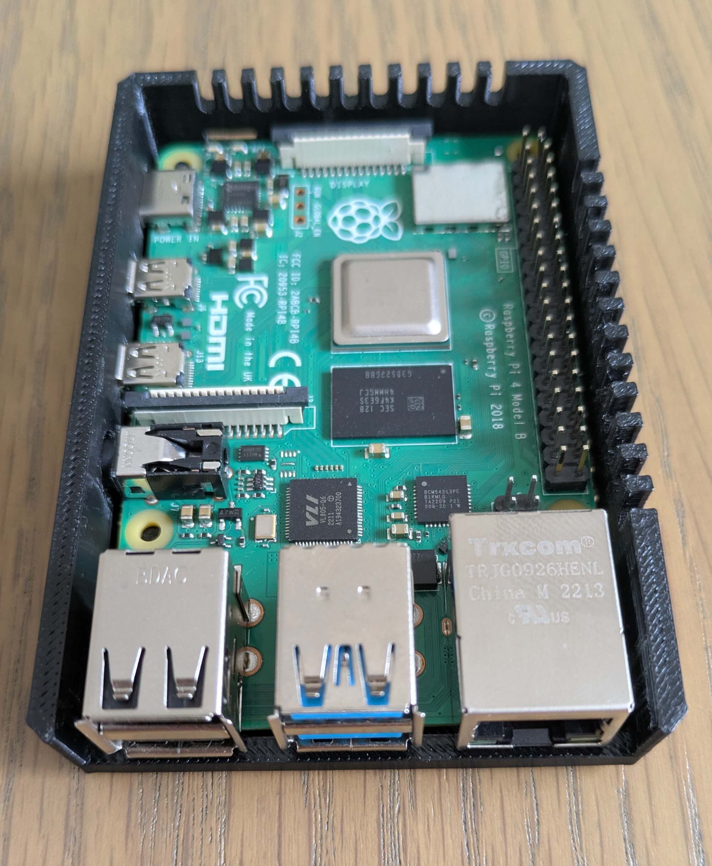 A close-up of a Raspberry Pi 4 Model B single board computer, indicating hardware expertise.
